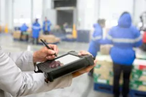 Bluetooth barcode scanner checking goods in warehouse